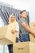© mawardibahar - Young couple shifting the box with family concept.