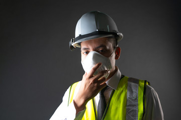 Construction worker wearing mask.