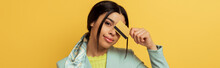 Panoramic Shot Of Pretty African American Girl Covering Eye With Credit Card On Yellow
