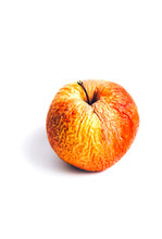 An Old Shrivelled Apple With Lots Of Wrinkles On A White Background. Isolated.