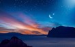 Ramadan background with crescent, stars and glowing clouds with ray from skies above mountains and sea. Month of Ramadan is that in which was revealed Quran.