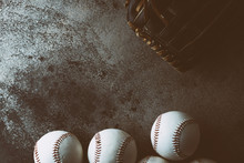 Moody Baseball Background With Top View Of Balls And Grunge Backdrop, Copy Space For Sports Graphic.