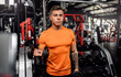 © JonoErasmus - Fit young man working out with dumbbells at the gym