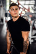 © JonoErasmus - Muscular young man doing cable tricep pulldowns at the gym