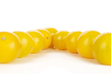 Wall Mural - Lot of whole fresh yellow tomato delta isolated on white background