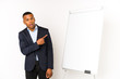 © Asier - Young latin man with a white board isolated on a white background pointing to the side
