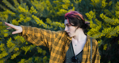 young goth model with her arm streched out posing