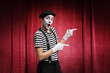 © Ljupco Smokovski - Pantomime man performing in a theater with red curtains