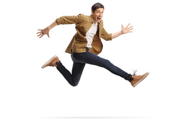 casual happy young man jumping