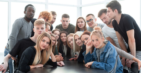 large group of friends sitting at a table