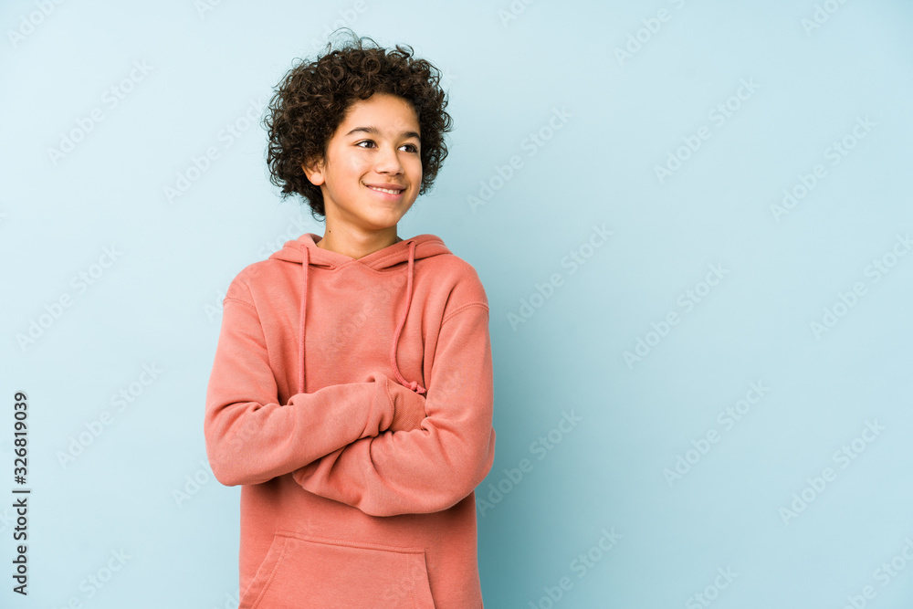 African american little boy isolated smiling confident with crossed arms. - obrazy, fototapety, plakaty 