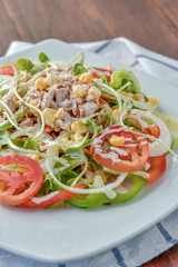 Wall Mural - Tuna salad with red raw tomato, fresh lettuce. Hight vitamins and low fat for loose weight. Heathy food concept.