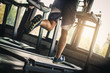 © Sirichai - People running in machine treadmill at fitness gym . Young asian man in sportswear running on treadmill at gym. Running fast. Soft focus.