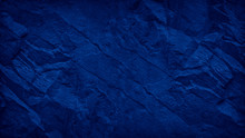 Blue Grunge Background. Toned Mountain Texture. Close-up. Navy Blue Rocky Texture With Copy Space For Your Design. Colored Rock Background.