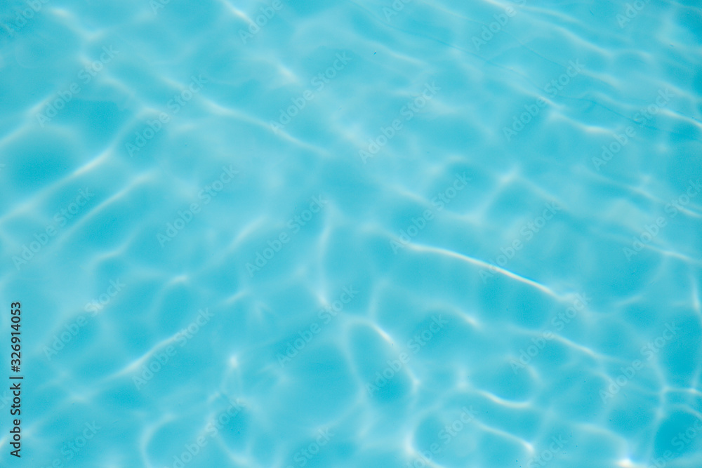 Blue water ripple reflection in the swimming pool