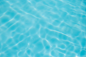 Blue water ripple reflection in the swimming pool