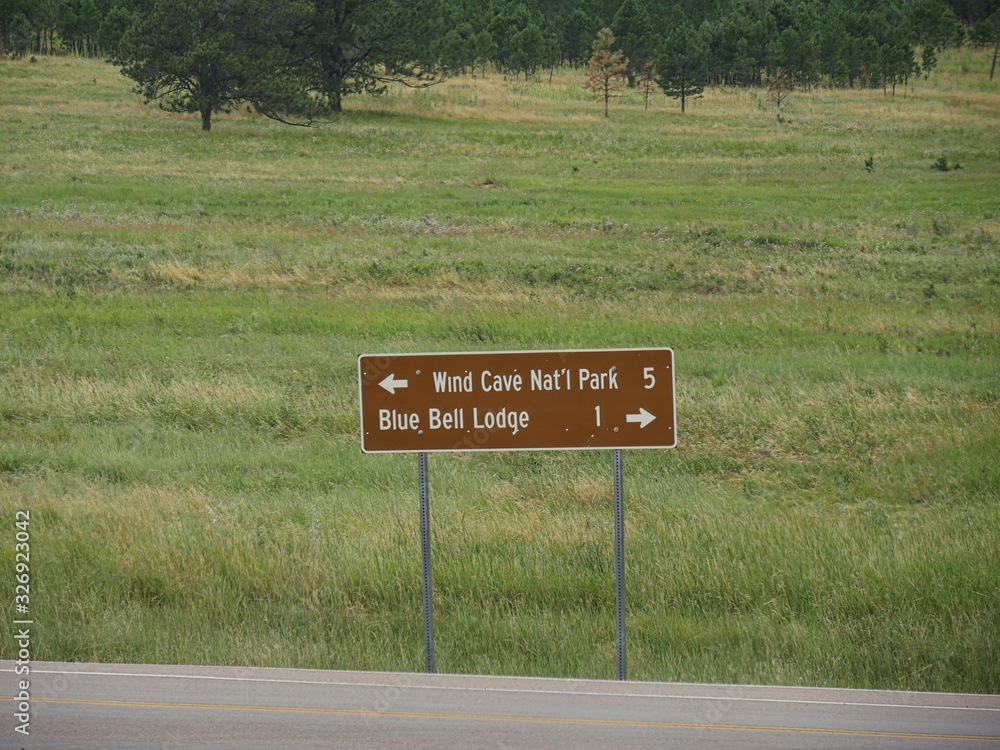 Custer Sd Sign Roadside sign with directions to the Wind Cave National Park and Blue ...