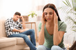 Unhappy woman after quarrel with her boyfriend at home. Relationship problems