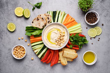 Hummus Plate With A Variety Of Vegetables And Bread. Healthy Snack Or Meze