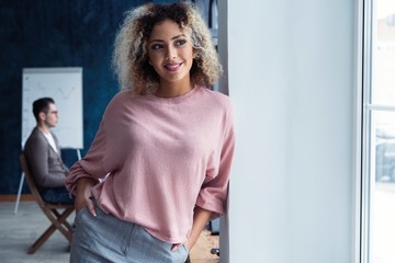 Modern young African business woman in the office with copy space.