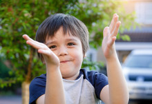 Happ Kid Smiling And Clapping His Hands, Outdoor Portrait Healhty Child Boy Having Fun Playing In The Garden Or The Park In Sunnyday Spring, Summer