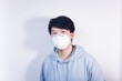 © Steve - A man wearing a N95 medical protective mask