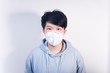 © Steve - A man wearing a N95 medical protective mask