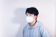 © Steve - A man wearing a N95 medical protective mask