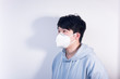 © Steve - A man wearing a N95 medical protective mask