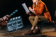 © LIGHTFIELD STUDIOS - selective focus of actor with clapboard in front
