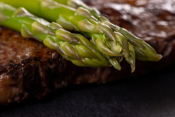 Poster - green asparagus on a steak