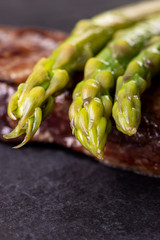 Poster - green asparagus on a steak