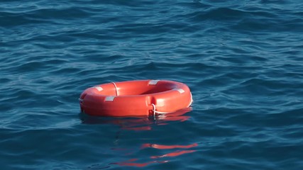 Wall Mural - Life buoy or rescue buoy floating on sea to rescue people from drowning man.