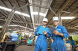 © MAGNIFIER - Industrial engineers are talking. They work at the heavy Industry manufacturing facility.