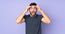 Caucasian Handsome Man With Surprise Expression Over Isolated Purple Background