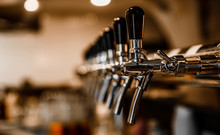 Many Beer Taps In Bar Or Pub