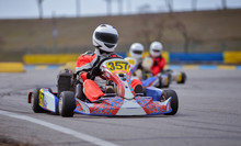 Young Go Cart Racer On Circuit