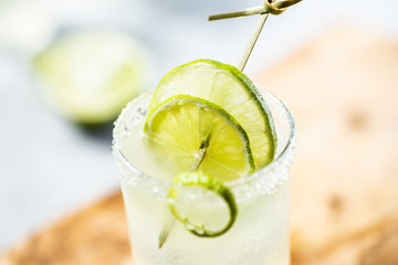 Margarita drink with lime slice.White background. Hard light.