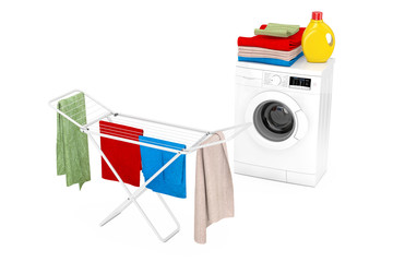 Poster - Clothes over White Folding Metal Clothes Drying Rack near White Modern Washing Machine with Detergent Bottle and Pile of Clothes. 3d Rendering