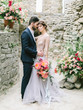 © smishura - Wedding couple groom and bride together on wedding day. Romantic wedding moment. Wedding ceremony in nature.