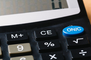 Modern calculator, Business and Finance accounting concept on wooden table