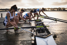 Female Rowing Team Training On A River