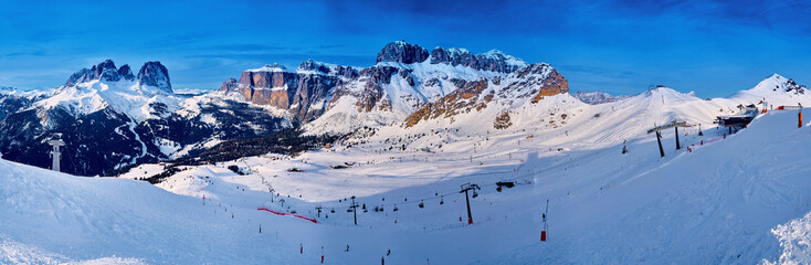 Beautiful panoramic view to the Sellaronda - the largest ski carousel in Europe - skiing the four most famous passes in the Dolomites (Italy), extraordinary snowy peaks of the dolomites, southern alps