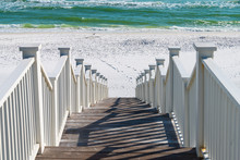 Seaside, Florida Railing Wooden Stairway Walkway Steps Looking Down View Of Architecture By Beach Ocean Background View Down During Sunny Day