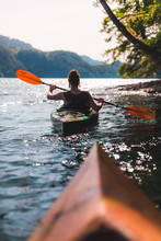 Girl In Kayak On Lake