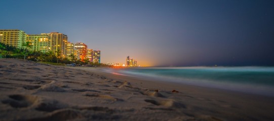 beach sea water night lights illuminated ocean landscape sand blue coast dawn dusk cloud summer city tourism waves beautiful coast vacation florida