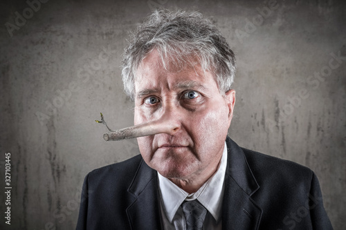 Cuadros en Lienzo Dishonest puppet business man with a long wooden nose, liar concept