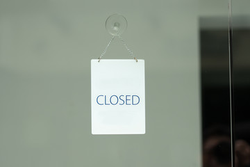 Wall Mural - sorry we are closed sign hanging outside a restaurant, store, office or other