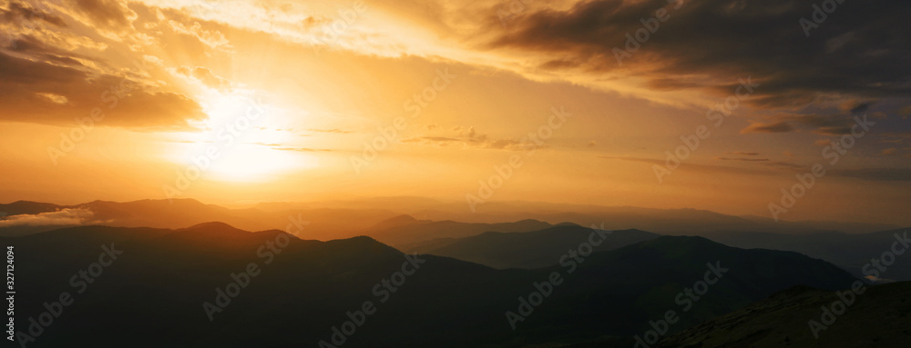 attractive mountains scene, stunning summer dawn landscape, hills mountains covered forest on background morning valley in golden sunlight and dramatic sky, amazing panoramic nature scenery. - obrazy, fototapety, plakaty 