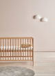 Decorative baby room, crib wooden furniture detail and cabinet style.